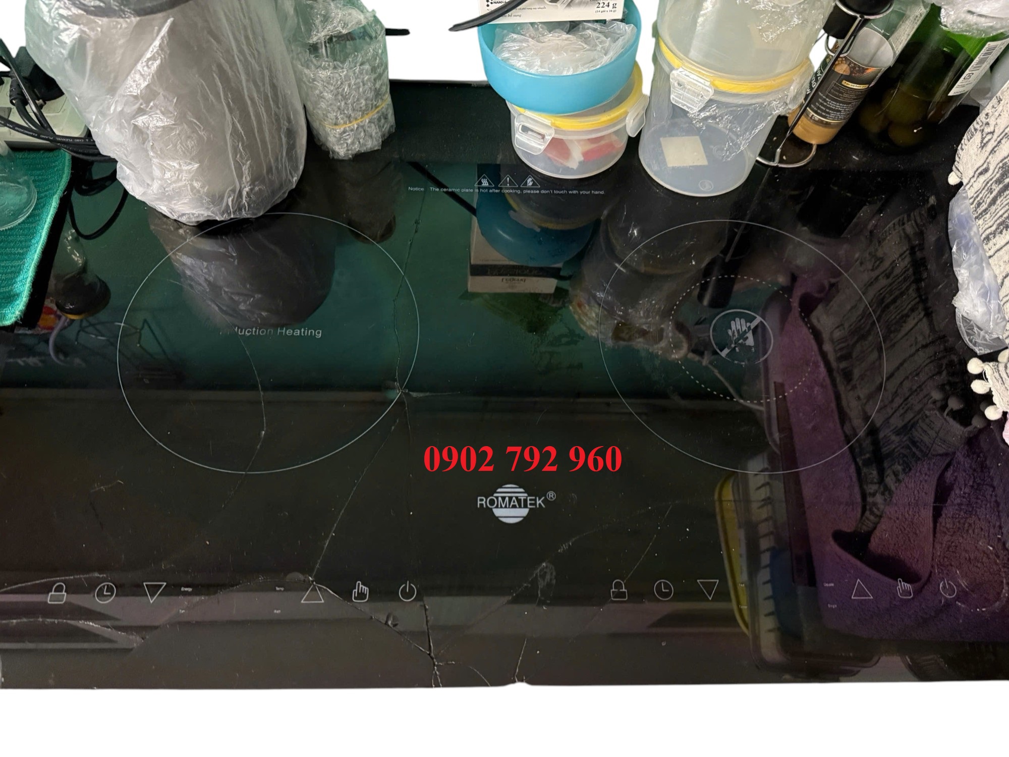Thay mặt kính bếp điện từ Romatek – Dịch vụ tận nhà tại Quận 5